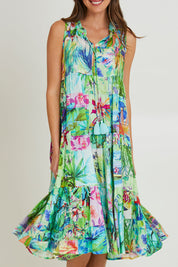 Model Madeline wearing size 10 of the Darcie Boho Sleeveless Dress in colour Print (Green), from the front, cropped image