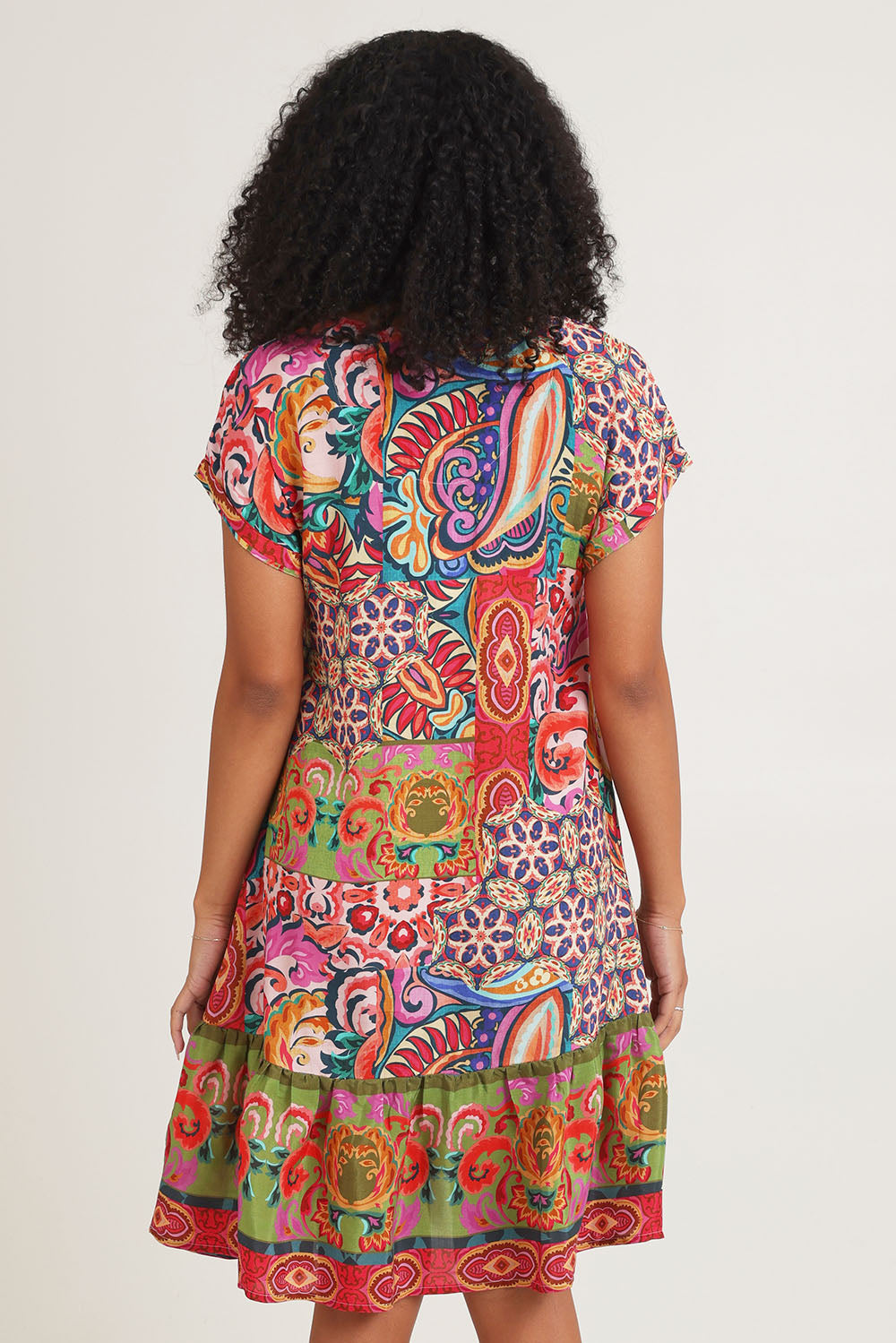 Model Ziara wearing size 10 of the Francesca Short Sleeve Dress in colour Print, from the back