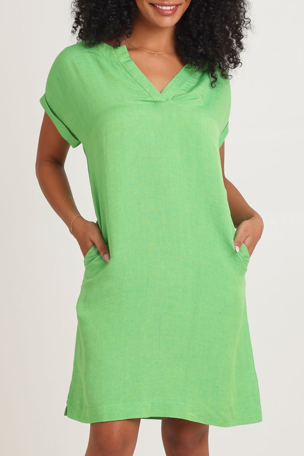 Model Ziara wearing size 10 of the Linen Blend Solid Shift Dress in colour Green (Green), from the front, cropped image