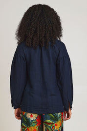 Model Ziara wearing size 10 of the Linen Blend Tassel Top in colour Navy (Blue), from the back