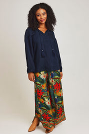 Model Ziara wearing size 10 of the Linen Blend Tassel Top in colour Navy (Blue), from the front, showing the whole outfit