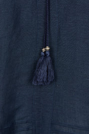 Product shot of the Linen Blend Tassel Top in colour Navy (Blue), detail