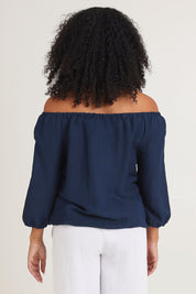 Model Ziara wearing size 10 of the Gather Neck 3/4 Sleeve Linen Blend Top in colour Navy (Blue), from the back