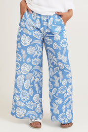 Model Ziara wearing size 10 of the Linen Print Blue Pant in colour Blue (Blue), from the front, cropped image