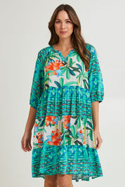 Model Madeline wearing size 10 of the Olivia Layers 3/4 Sleeve Dress in colour Print (Blue), from the front, cropped image