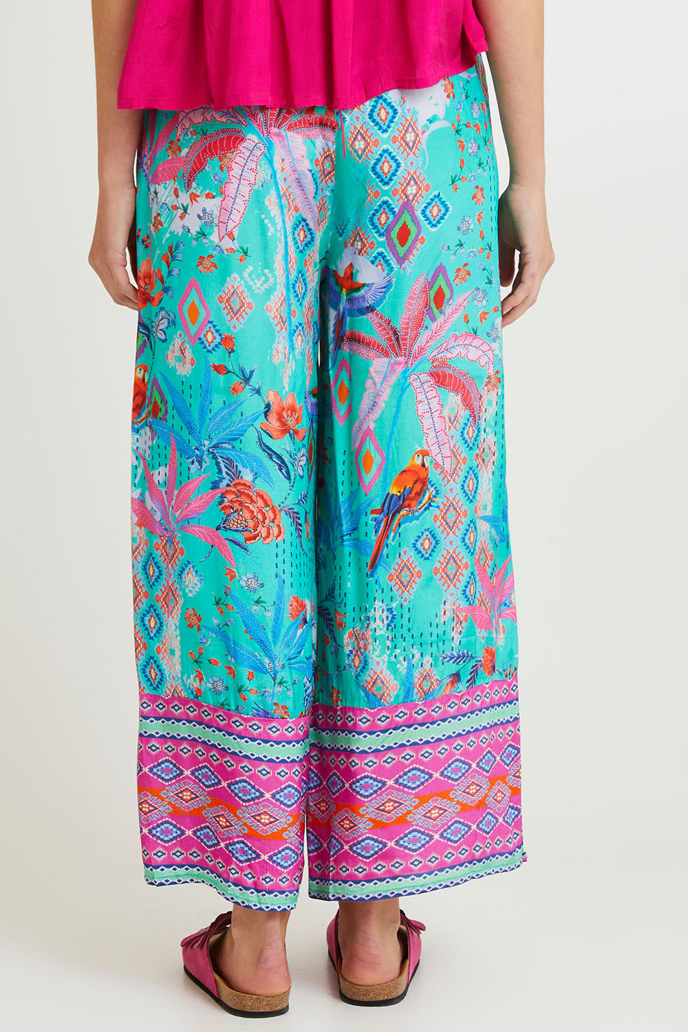 Model Madeline wearing size 10 of the Marina Pant in colour Print (Blue), from the back