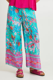 Model Madeline wearing size 10 of the Marina Pant in colour Print (Blue), from the front, cropped image