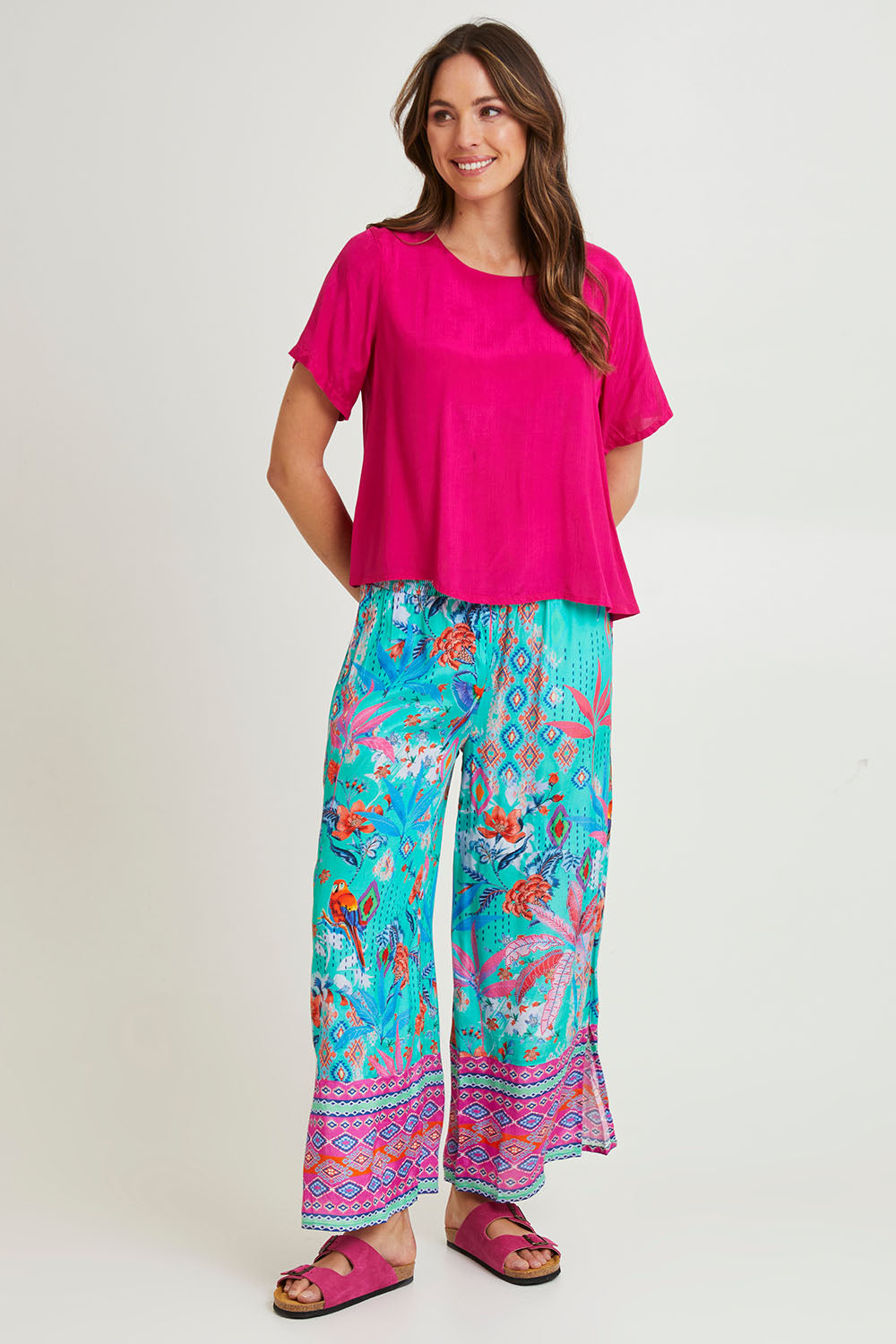 Model Madeline wearing size 10 of the Marina Pant in colour Print (Blue), from the front, showing the whole outfit