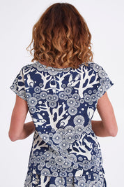 Model Emma wearing size S of the Mikko Tilly Top in colour Indigo (Blue), from the back