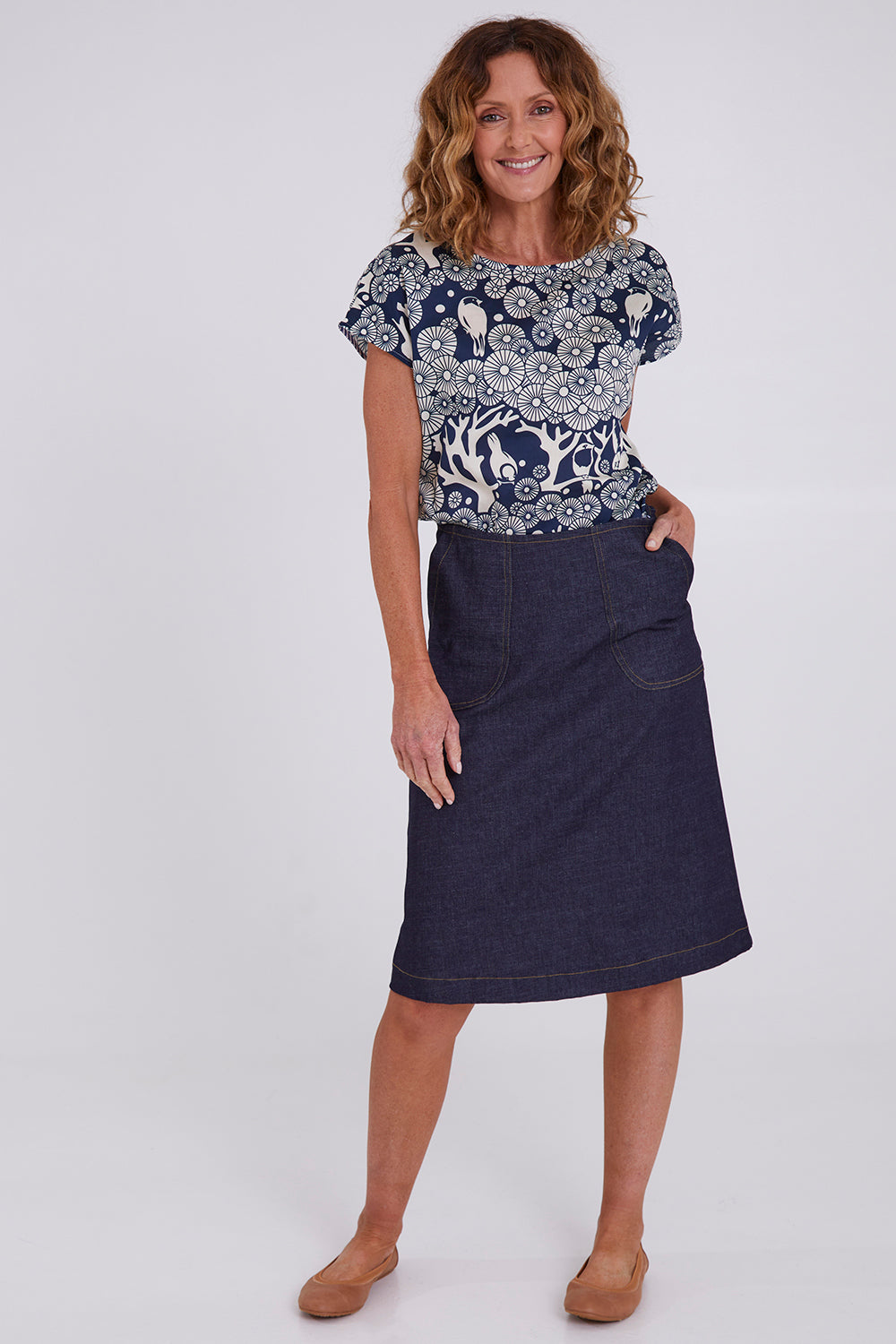 Model Emma wearing size S of the Mikko Tilly Top in colour Indigo (Blue), from the front, showing the whole outfit