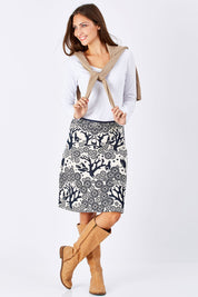 Model Anna wearing size S of the Mikko Aline Skirt in colour InkNatural, from the front, showing the whole outfit