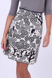A model wearing the Mikko Aline Skirt in colour InkNatural, from the front, cropped image