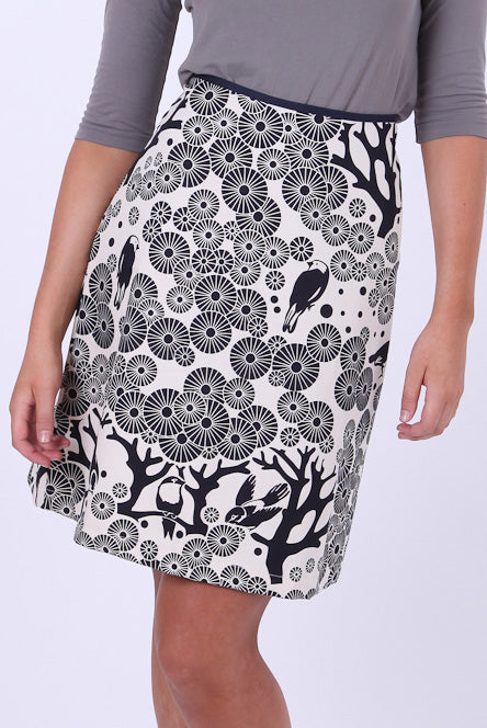 A model wearing the Mikko Aline Skirt in colour InkNatural, from the front, cropped image
