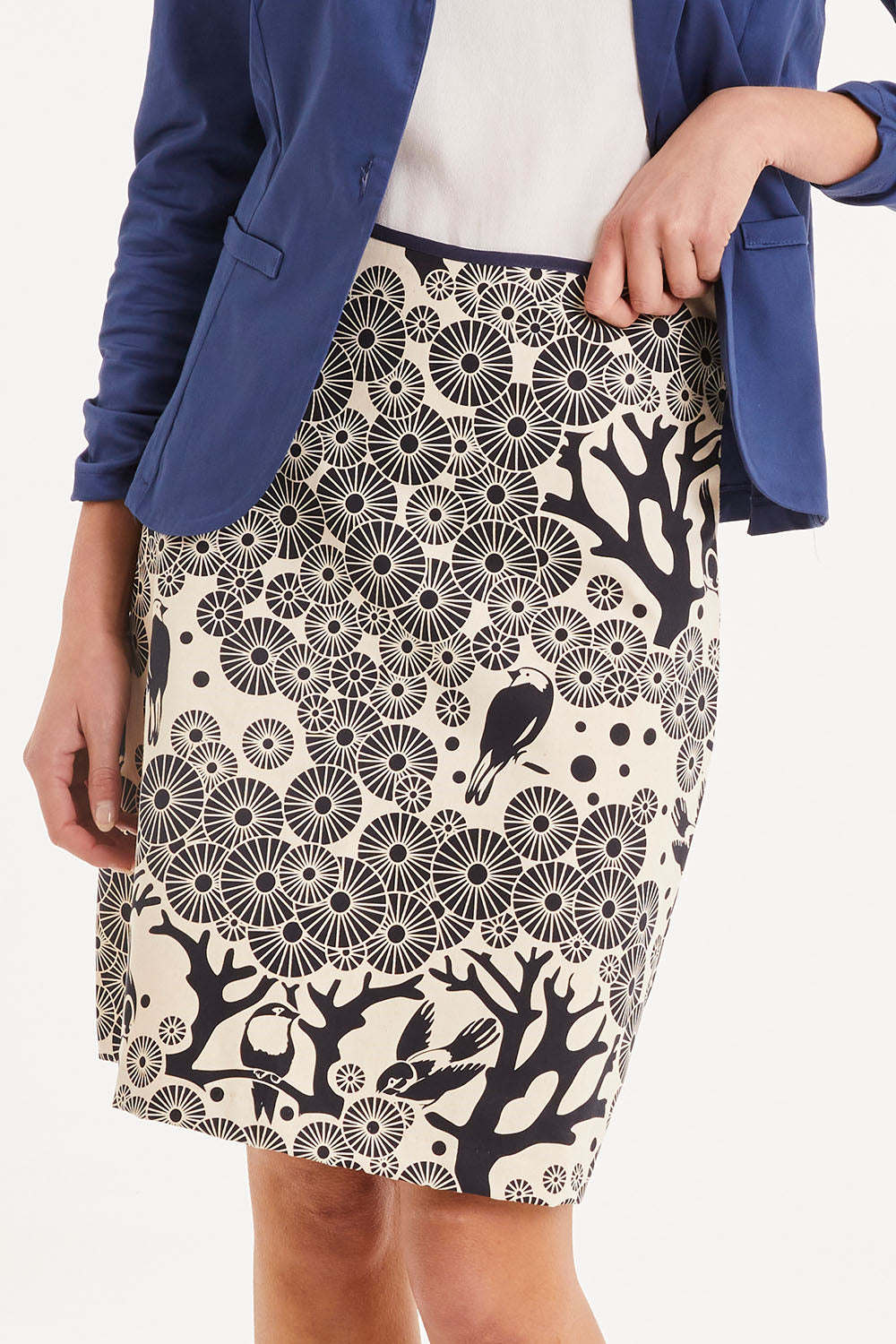 Model Madeline wearing size S of the Mikko Aline Skirt in colour InkNatural, from the front, cropped image