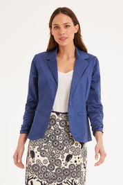 Model Madeline wearing size S of the Mikko Aline Skirt in colour InkNatural, from the front, cropped image