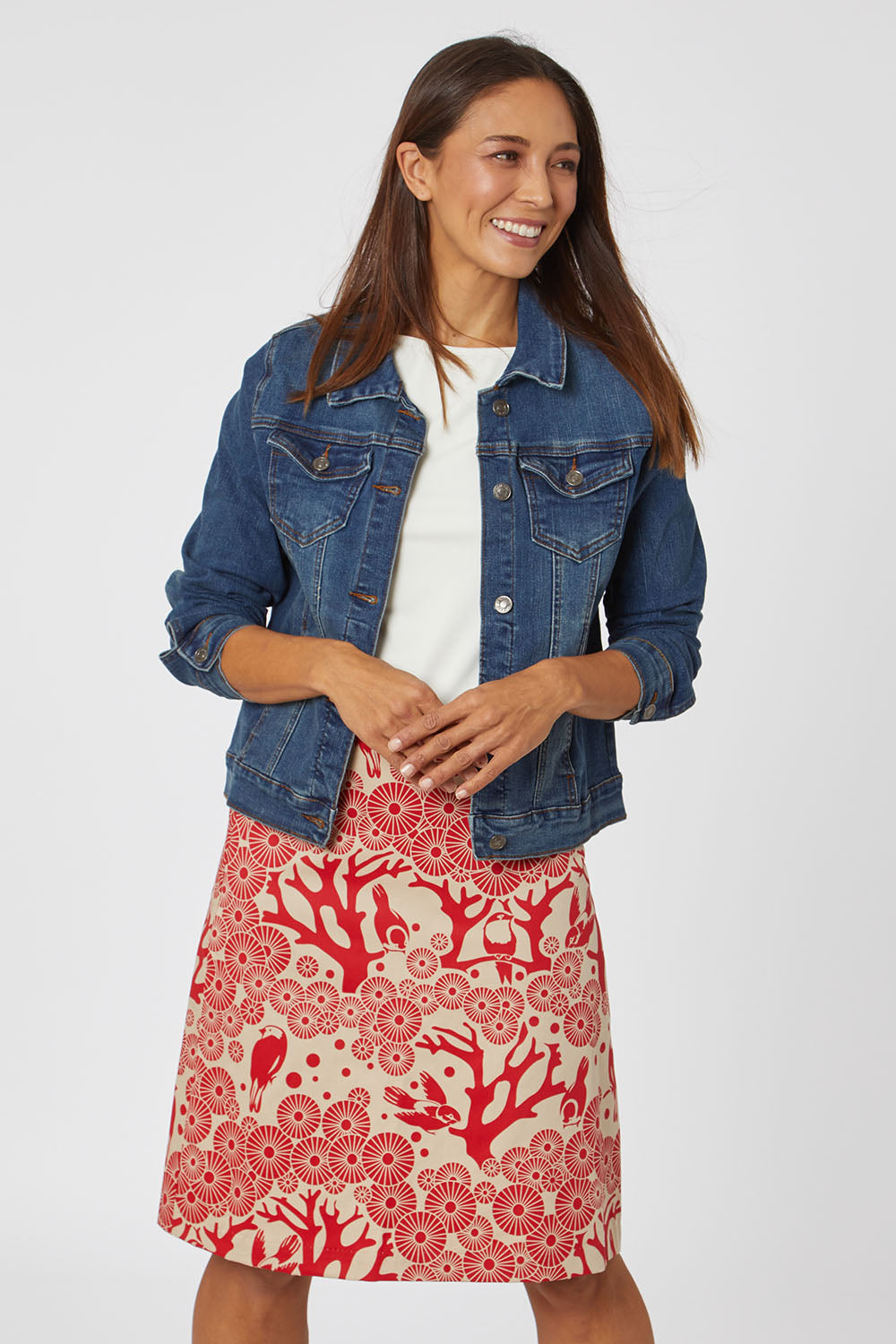 Model Cara wearing size S of the Mikko Aline Skirt in colour LipChino (Red), from the front, cropped image