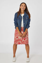 Model Cara wearing size S of the Mikko Aline Skirt in colour LipChino (Red), from the front, showing the whole outfit