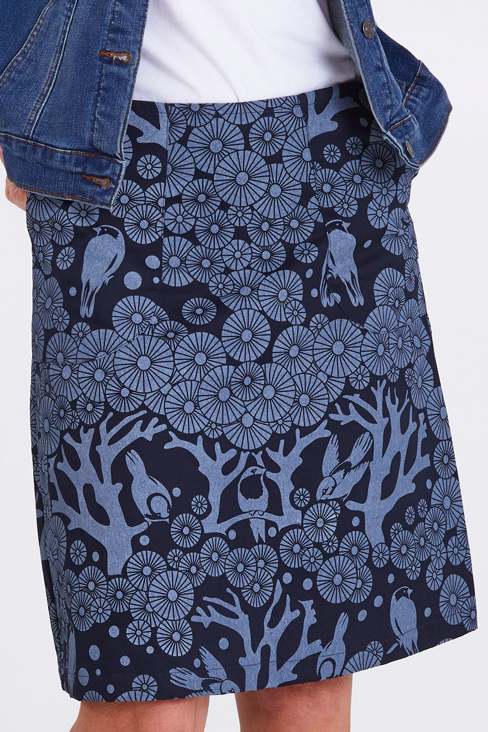 Model Emma wearing size S of the Mikko Zoe Skirt in colour Navy (Blue), from the front, cropped image