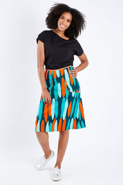Model Schanez wearing size S of the Avril Skirt Long in colour Orange (Blue), from the front, showing the whole outfit
