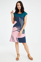 Model Andrea wearing size S of the Bobby Dress in colour Pink (Blue), from the front, showing the whole outfit