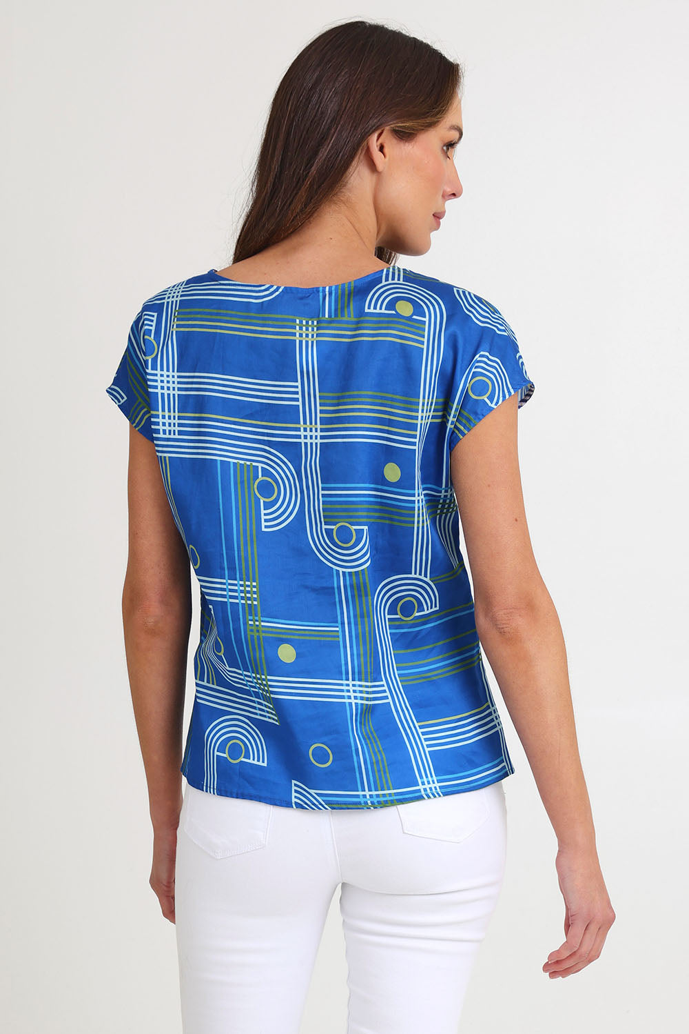 Model Madeline wearing size S of the Tilly Cotton Top in colour Blue (Blue), from the back