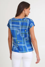 Model Madeline wearing size S of the Tilly Cotton Top in colour Blue (Blue), from the back