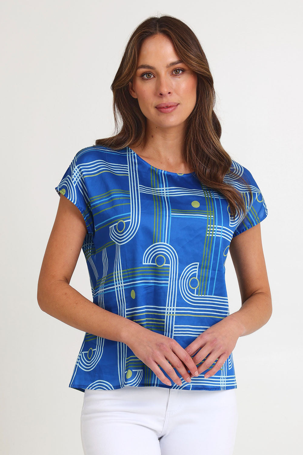 Model Madeline wearing size S of the Tilly Cotton Top in colour Blue (Blue), from the front, cropped image