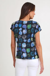 Model Madeline wearing size S of the Tilly Cotton Top in colour Black (Black), from the back