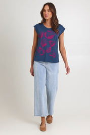 Model Madeline wearing size S of the Bobby Cotton Top in colour Articblue (Blue), from the front, showing the whole outfit