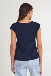Model Madeline wearing size S of the Bobby Cotton Top in colour Navylark (Blue), from the back