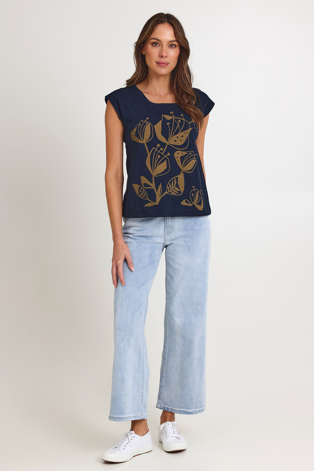 Model Madeline wearing size S of the Bobby Cotton Top in colour Navylark (Blue), from the front, showing the whole outfit