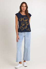 Model Madeline wearing size S of the Bobby Cotton Top in colour Navylark (Blue), from the front, showing the whole outfit