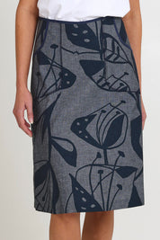 Model Madeline wearing size S of the Avril Long Cotton Skirt in colour Chambray (Grey), from the front, cropped image