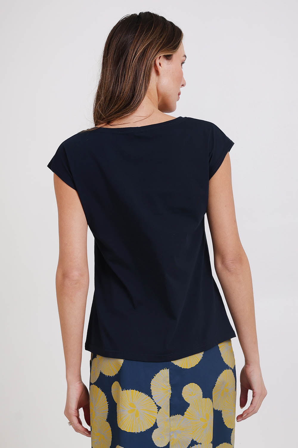 Model Madelinec wearing size 10 of the Bobby Top - Navy in colour Navy, from the back