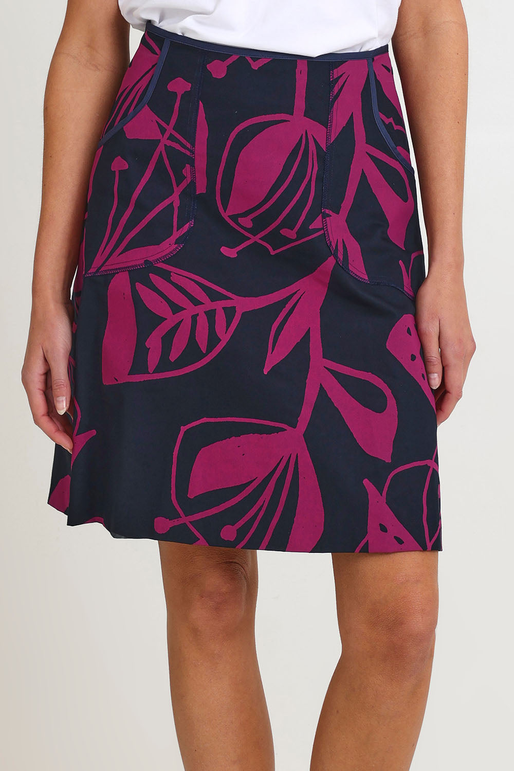 Model Madeline wearing size S of the Avril Cotton Skirt in colour Navy (Blue), from the front, cropped image