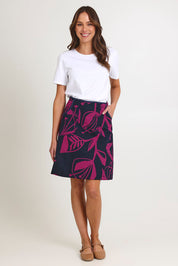 Model Madeline wearing size S of the Avril Cotton Skirt in colour Navy (Blue), from the front, showing the whole outfit