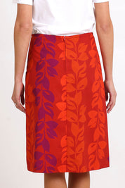 Model Madelinec wearing size 10 of the Heidi Long Skirt - Red in colour Red, from the back