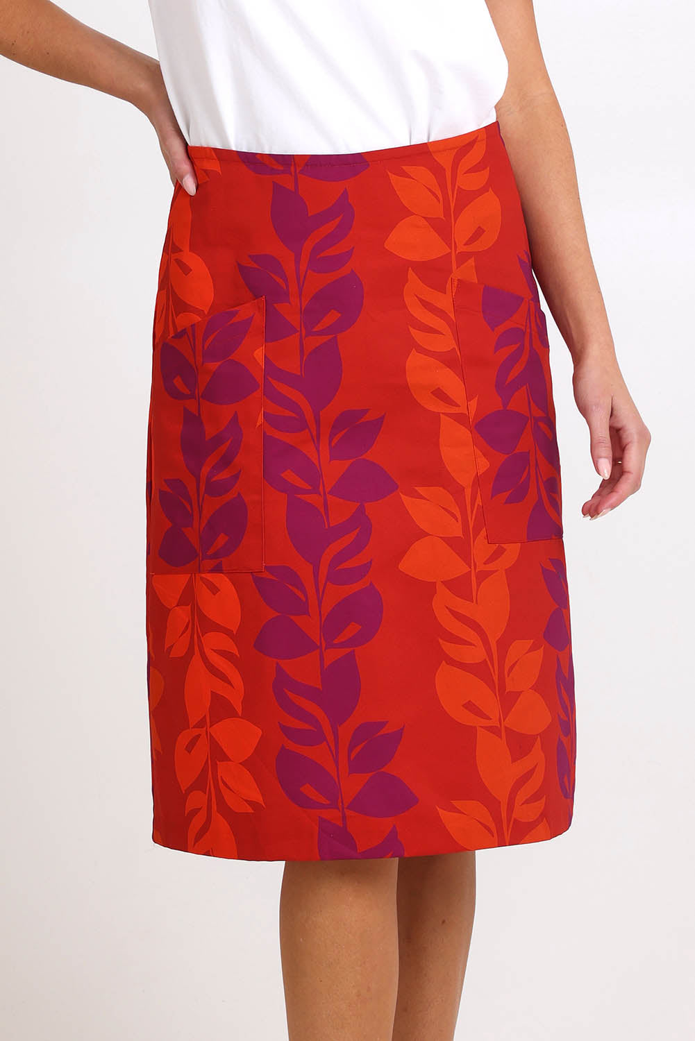 Model Madelinec wearing size 10 of the Heidi Long Skirt - Red in colour Red, in a cropped view