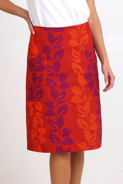 Model Madelinec wearing size 10 of the Heidi Long Skirt - Red in colour Red, in a cropped view