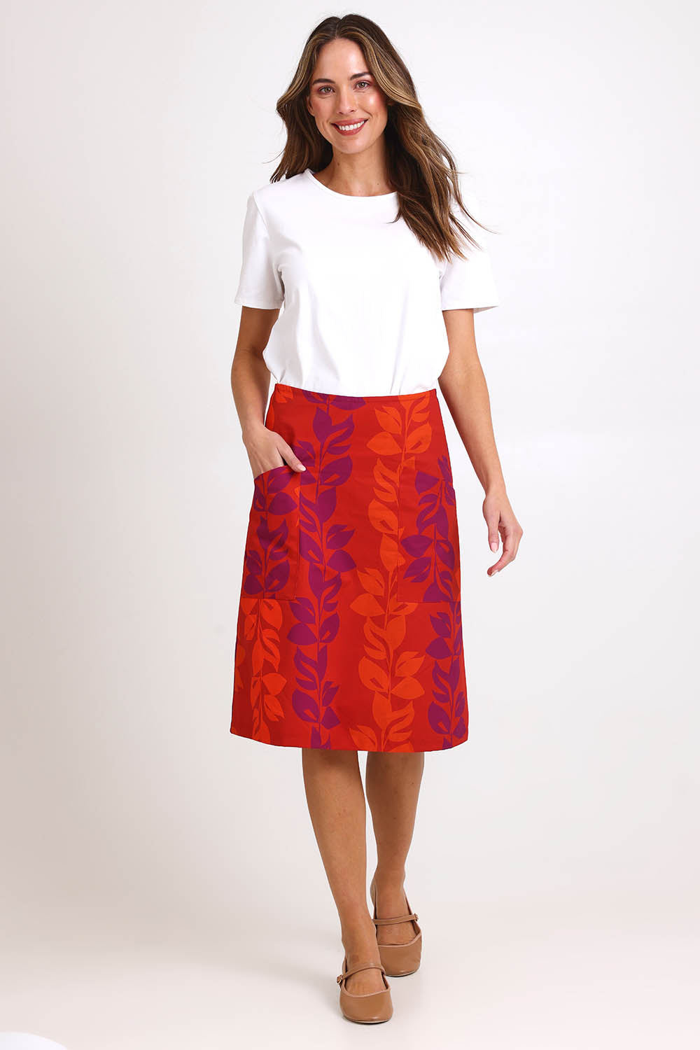 Model Madelinec wearing size 10 of the Heidi Long Skirt - Red in colour Red, from the front