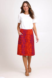 Model Madelinec wearing size 10 of the Heidi Long Skirt - Red in colour Red, from the front