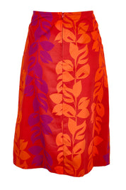 Product shot of the Heidi Long Skirt - Red in colour Red, from the back