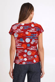 Model Madelinec wearing size 10 of the Tilly Top - Cloudred in colour Cloudred, from the back