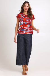 Model Madelinec wearing size 10 of the Tilly Top - Cloudred in colour Cloudred, from the front