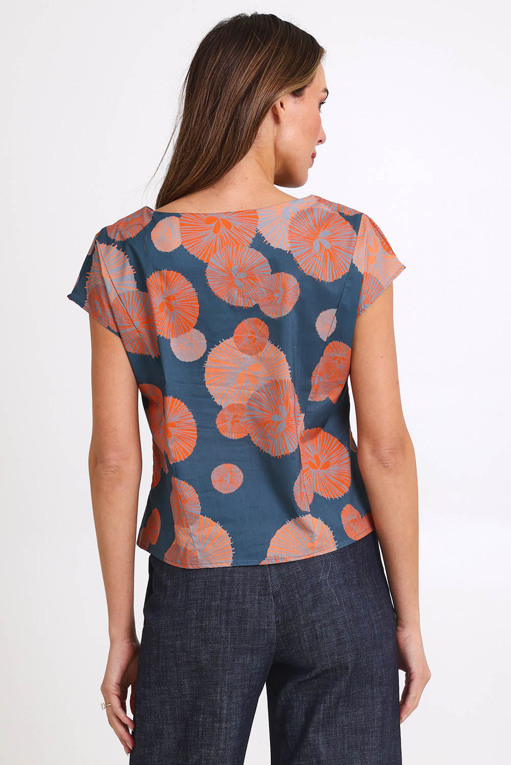 Model Madelinec wearing size 10 of the Thea Top - Smoke in colour Smoke, from the back