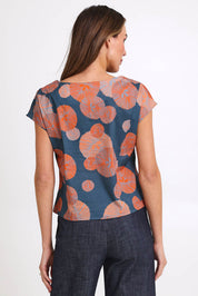 Model Madelinec wearing size 10 of the Thea Top - Smoke in colour Smoke, from the back