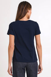 Model Madelinec wearing size 10 of the Girlfriend Tee - Navyorange in colour Navyorange, from the back