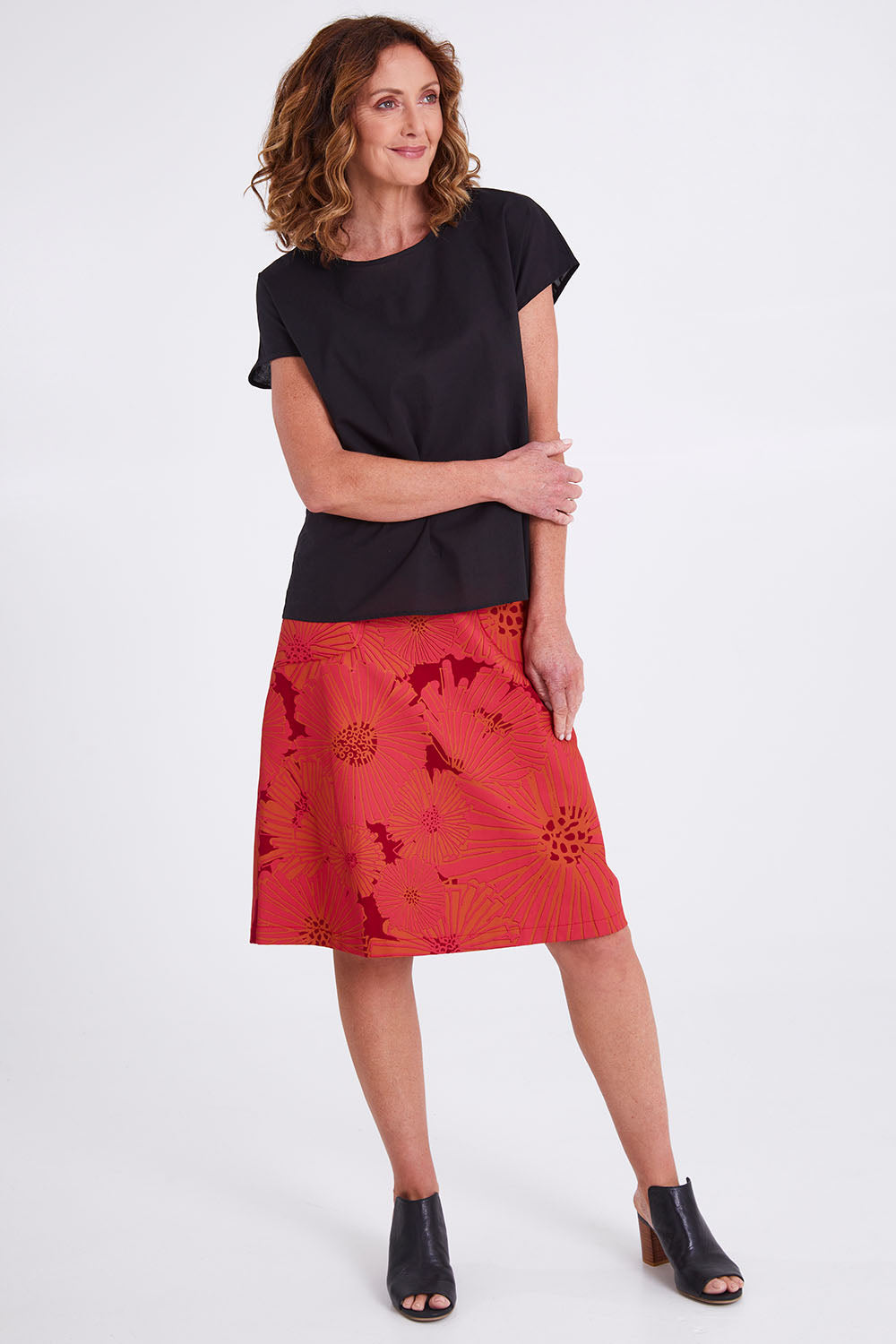 Model Emma wearing size S of the Tilly Top in colour Black (Black), from the front, showing the whole outfit