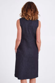 Model Emma wearing size S of the Susanne Denim Dress in colour Indigo (Blue), from the back