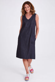 Model Emma wearing size S of the Susanne Denim Dress in colour Indigo (Blue), from the front, showing the whole outfit